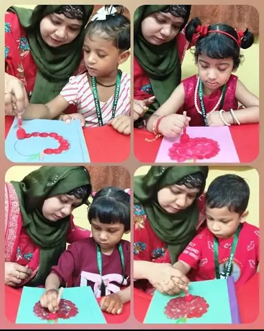 Teacher guiding children in dabbing painting